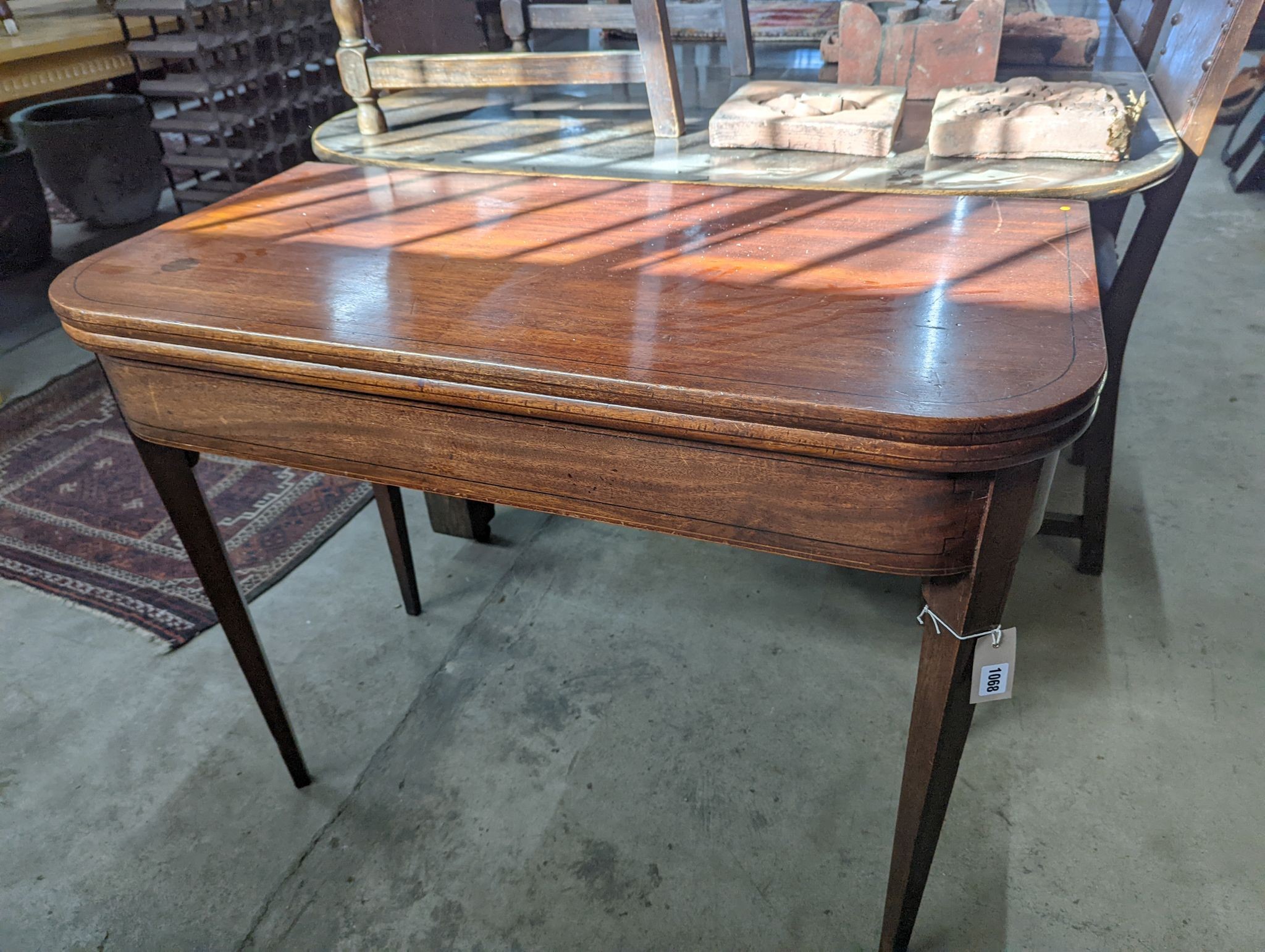 A George III rectangular mahogany folding card table, width 94cm, depth 47cm, height 74cm